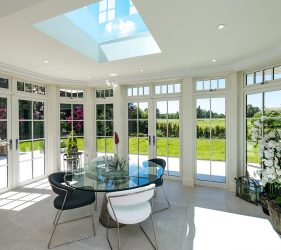 Conservatory with Traditional Style uPVC Timber Effect Flush Sash Windows and French Doors