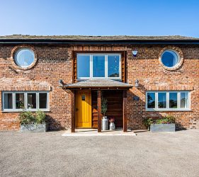 New Cottage Style Wood Effect Windows in Red Brick Barn Renovation Project