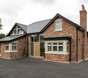 New Build Red Brick Property with Wood Style Timberlook Green Windows